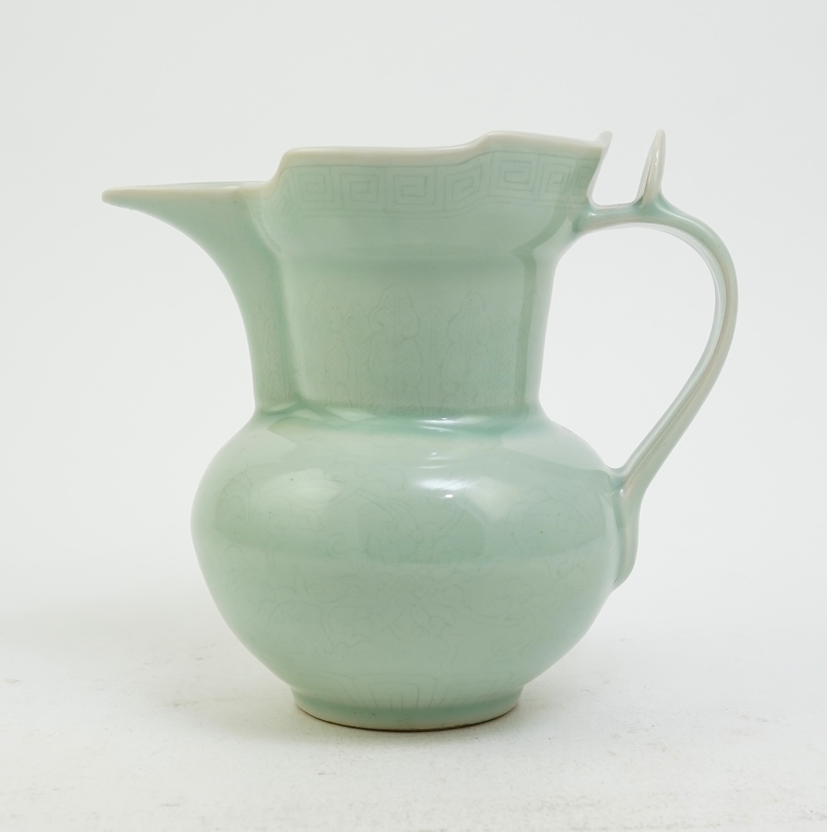 A Chinese incised celadon glazed monks cap ewer, Qianlong seal mark but later, 17cm
